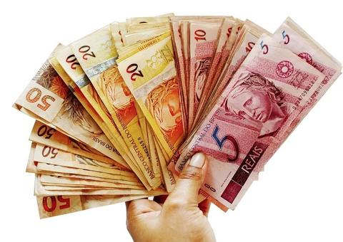 Caixa paga 3ª parcela de auxílio a beneficiários do Bolsa Família