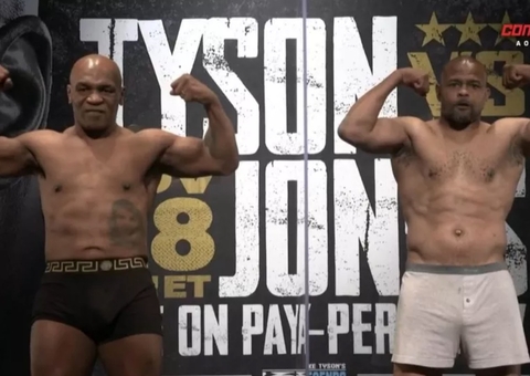 Myke Tyson e Roy Jones se encaram separados por parede de acrílico