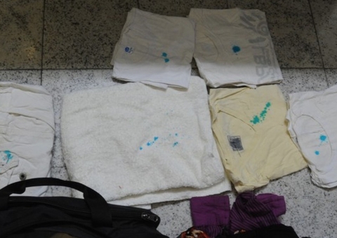 Mulher é flagrada em aeroporto com mala de roupas engomadas com cocaína