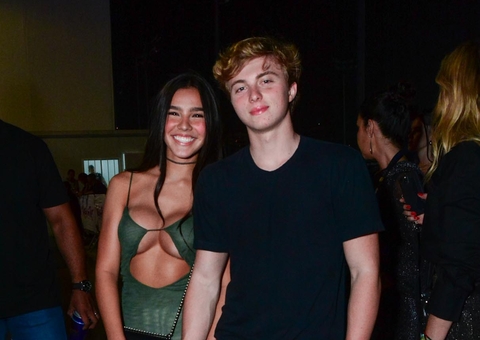 Aos 16, filho de Luciano Huck faz rara aparição com a namorada no Rock in Rio