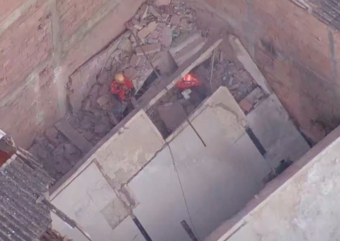 Bombeiros procuram bebê e pai desaparecidos sob escombros de prédio no RJ