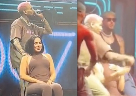 Chris Brown se irrita e arremessa celular de fã na plateia; Vídeo
