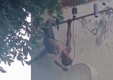 Homem tenta furtar fios de escola, leva choque e fica pendurado; vídeo