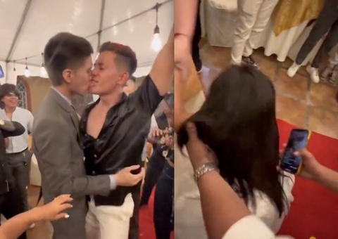 Noivo dá beijão em amigo na frente da esposa durante casamento e vídeo viraliza