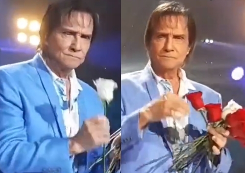 Após mandar fã calar a boca, Roberto Carlos entrega flores com cara fechada e vídeo viraliza