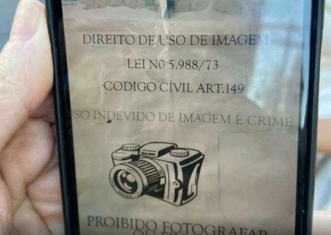 Em meio a casos de 'vacina de vento', cartaz proíbe filmagem em posto