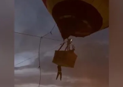 Jovem cai de 3 metros de altura após se pendurar em balão