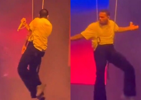 Chris Brown fica preso em fio durante show e precisa ser resgatado