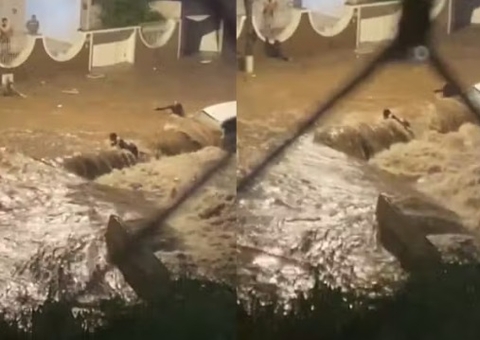 Mulher é arrastada por enxurrada durante temporal; vídeo