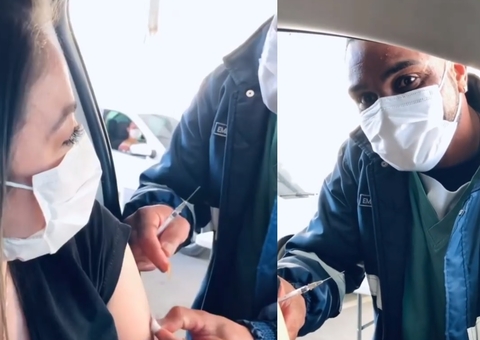 Em vídeo emocionante, irmã de Yudy é vacinada por enfermeiro que cuidou do pai: 'meu pesar'